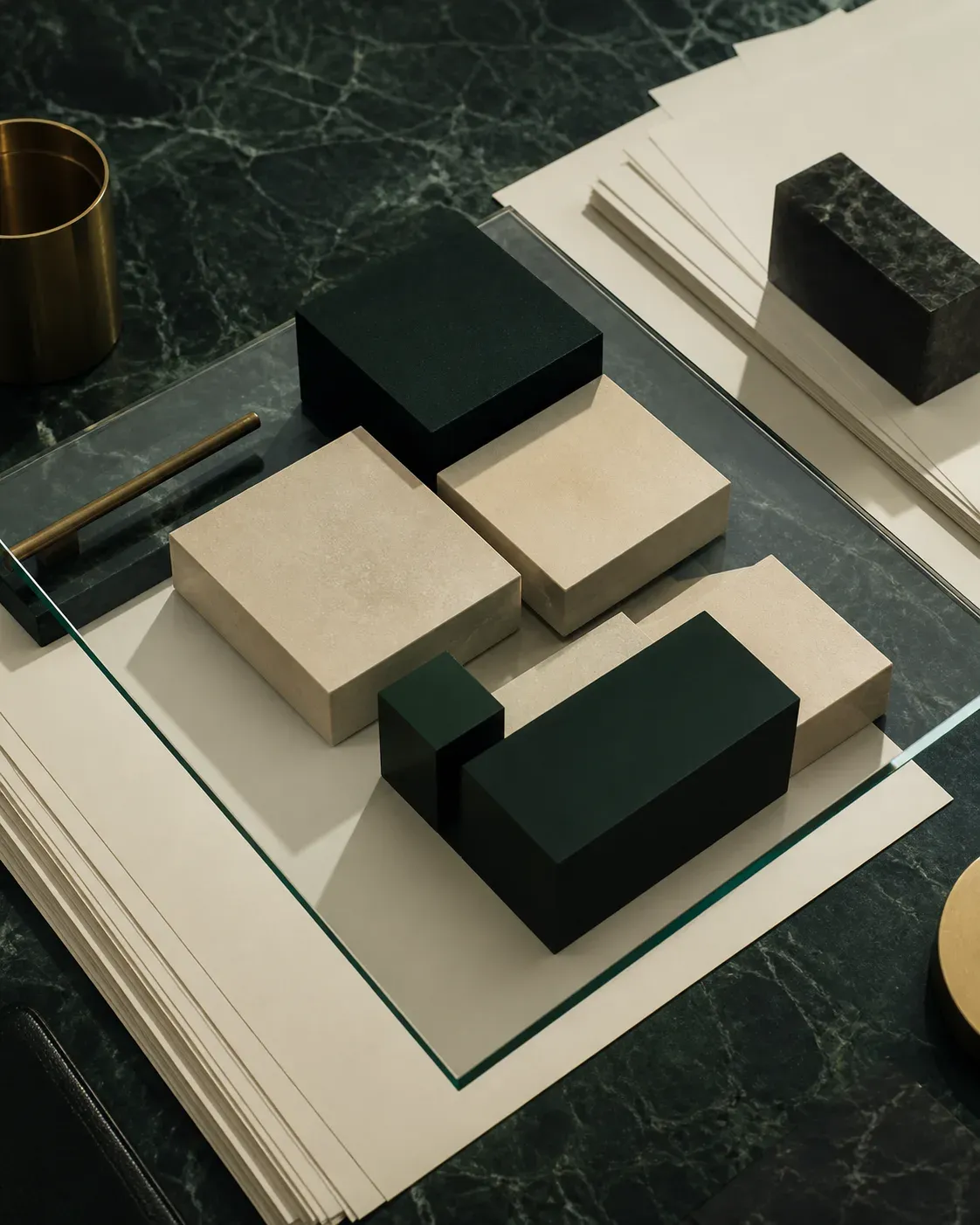 Deep green and beige geometric modules assembled on a table